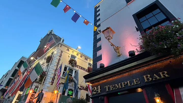 Flags and lights lining the street of the Temple Bar neighbourhood in Dublin, Ireland.