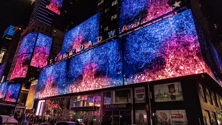 A digital image of a tree on a digital billboard in New York City's Times Square.