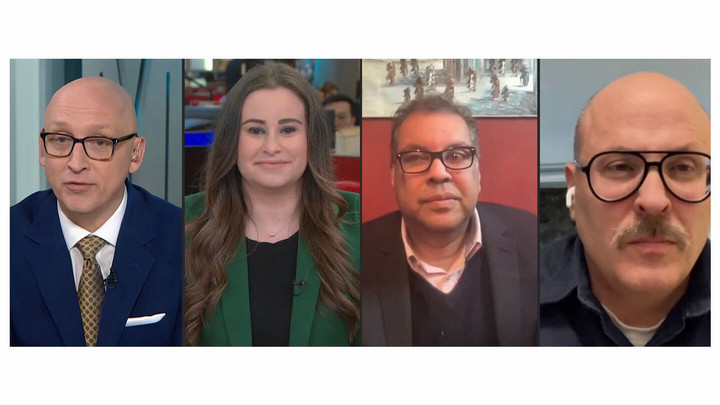 Panel of four people talking on a television program.