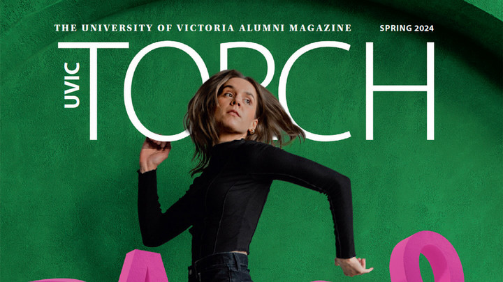 Woman dressed in black jumping with the words Torch University of Victoria Alumni Magazine above her.