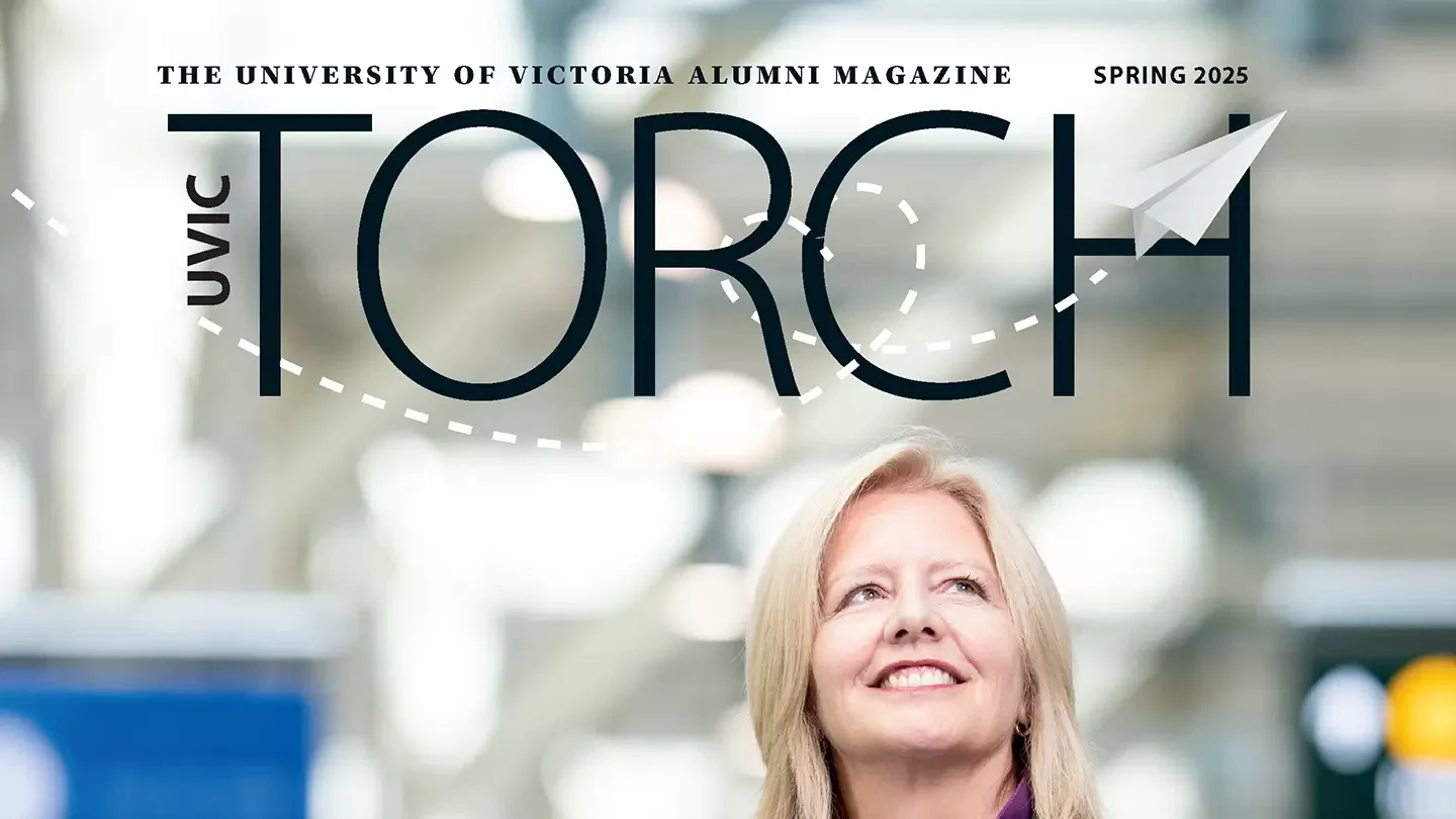 Magazine cover titled Torch UVic Alumni Magazine featuring photo of a woman smiling and looking upward in an airport. 