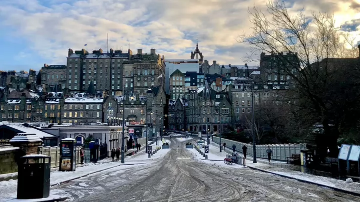 Old city buildings covered in snow.