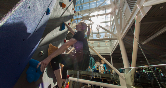 Woman climbing.