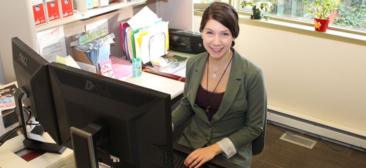 UVic employee at her desk