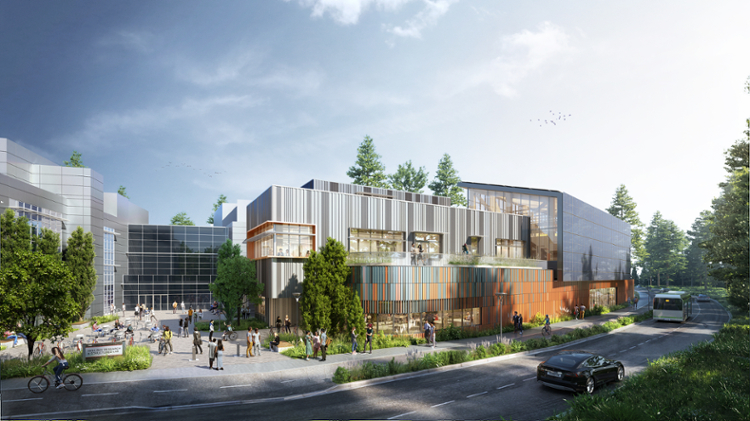 Rendering of the front entrance of a modern-style building. The building is mostly covered in paneling with the entrance surrounded by colourful vertical pieces. There are trees displayed in the foreground of the image, as well as some cars on the road in front of the building. There is a courtyard in front of the building, with lots of people walking in front. 
