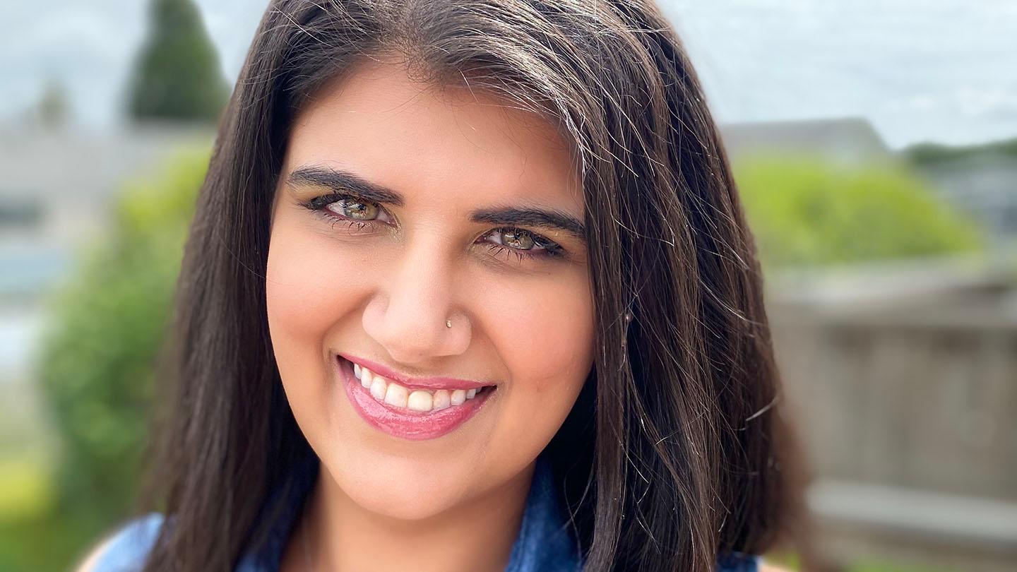 Dayah Johal smiles at the camera. A close-up of her face.