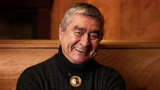 Photo of smiling older man with grey hair