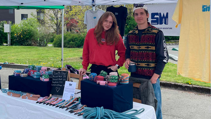 Kathryn Meers and a coworkers display StokesWorks products as a vending booth.