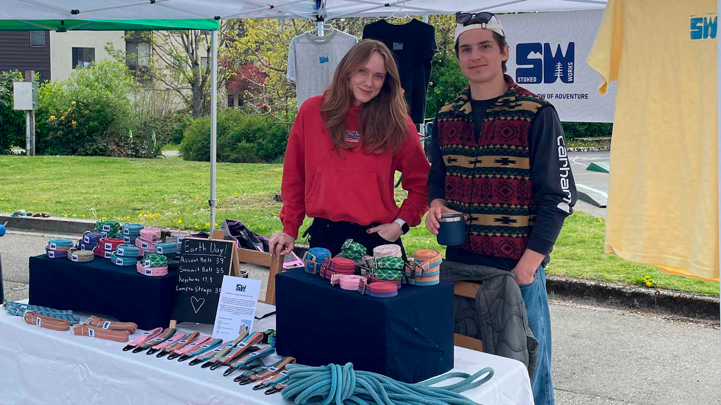 Kathryn Meers and a coworkers display StokesWorks products as a vending booth.