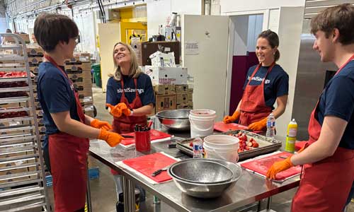 Staff prepare food as part of a community outreach program.