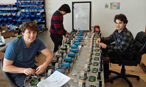 Students work with technical components.