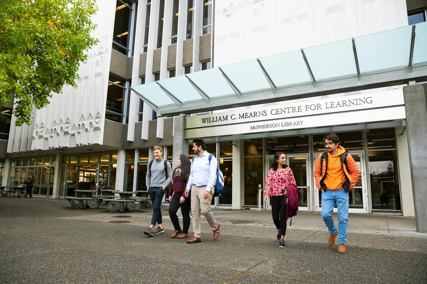 group of students in front of library