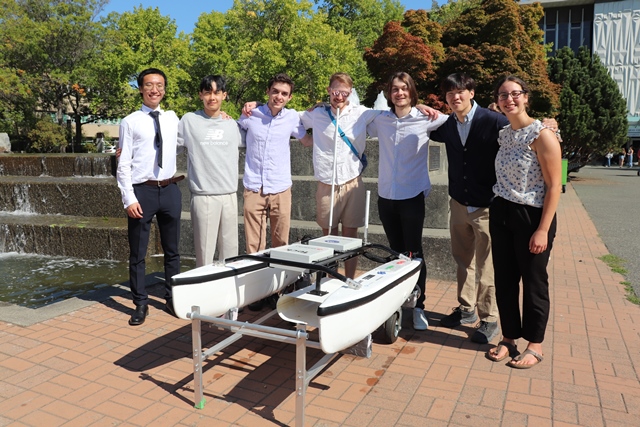 UVic Students part of the Environmental Engineering Club standing in front of the fountain.