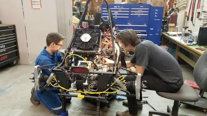 two students working on hybrid