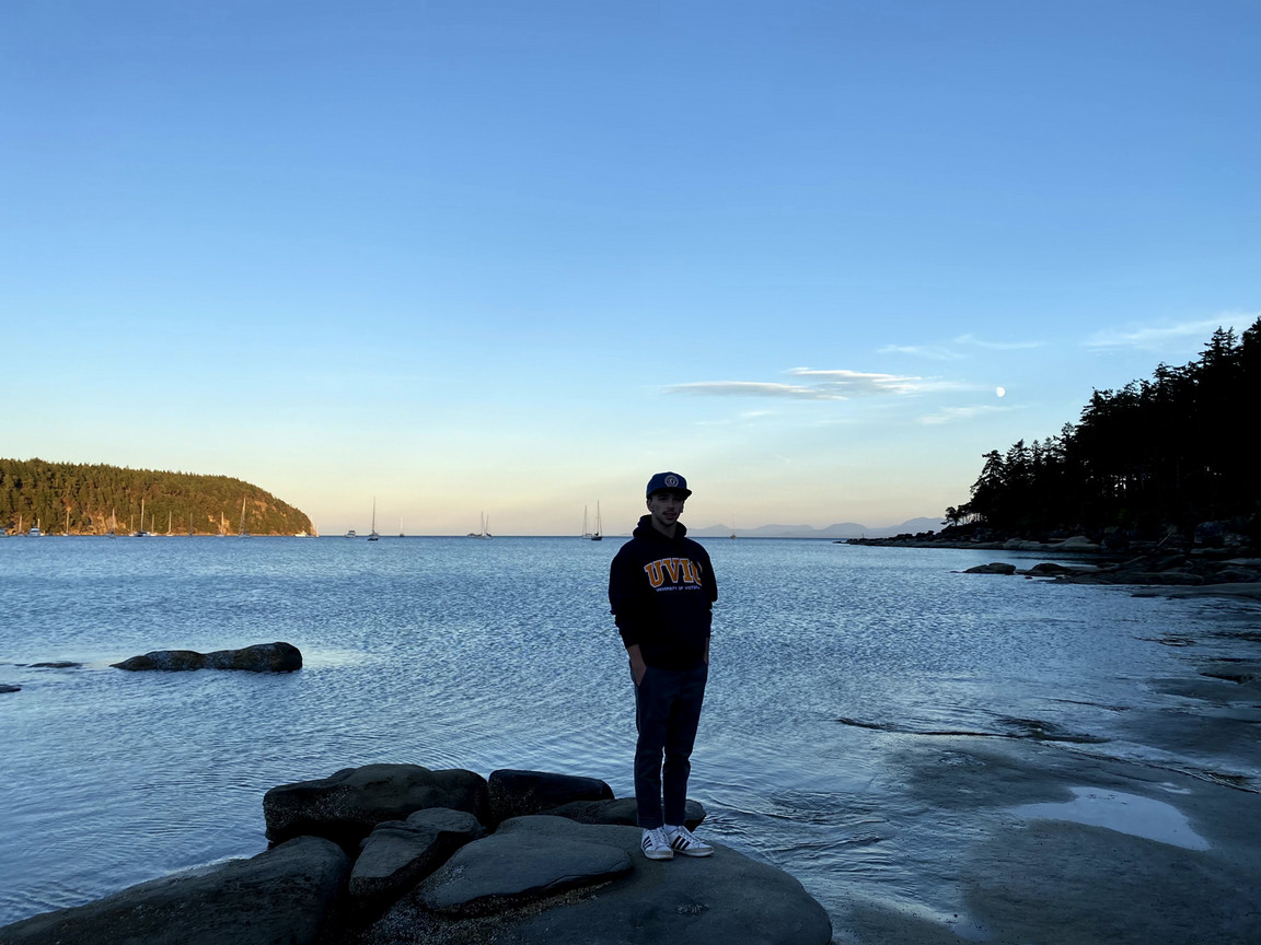 Cyrus Parsons standing on a beach