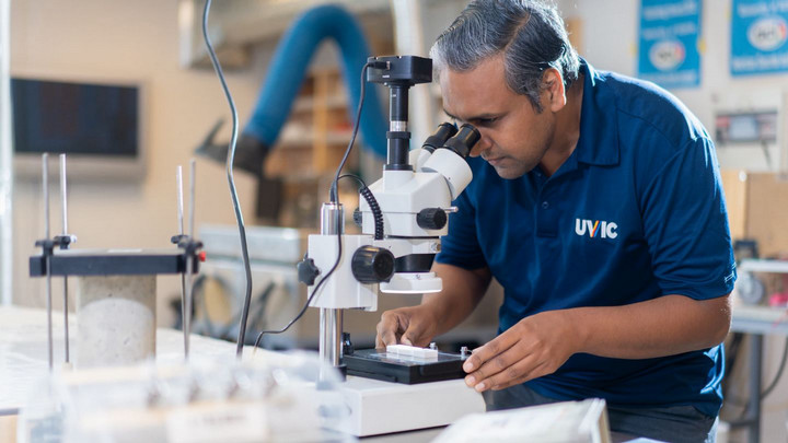 Person working with a microscope