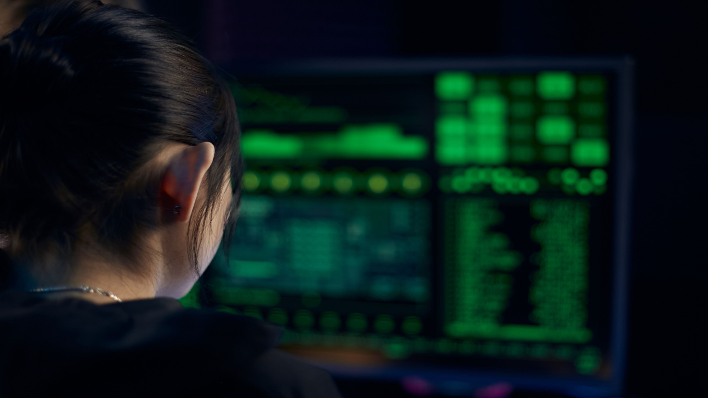 woman programming on computer
