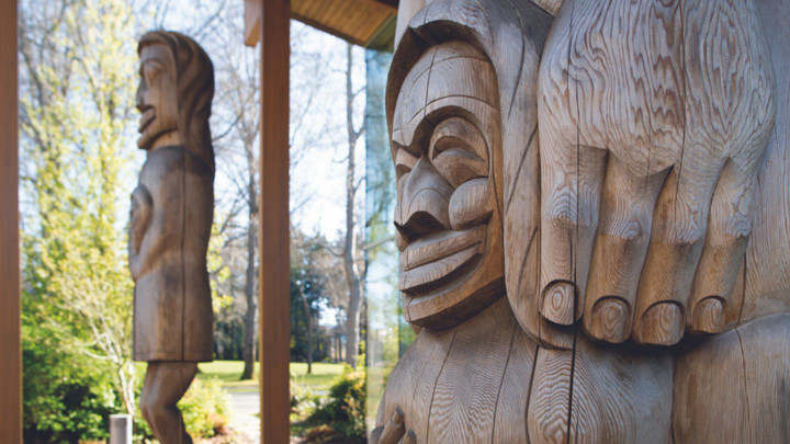 Totem poles outside of First Peoples House.