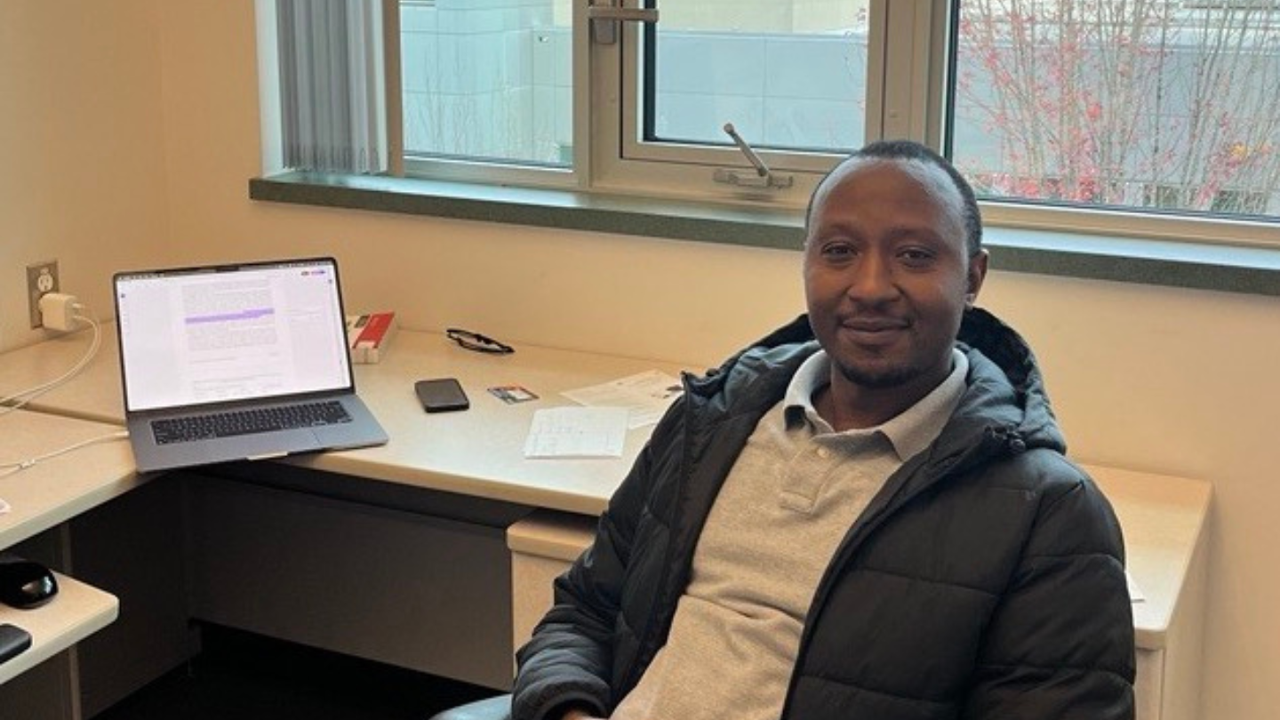 Ashery in his office at his desk.