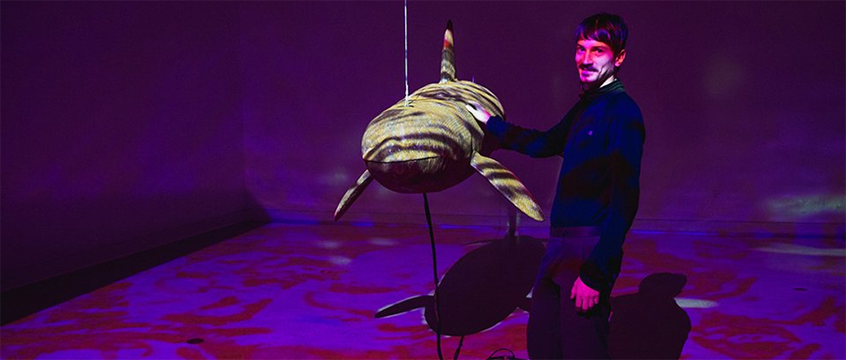 Colton Hash with his orca-sculpture installation