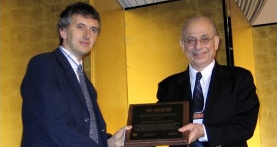 Dr. Andreas Antoniou receiving the IEEE Circuits and Systems Society (CAS) 2005 Technical Achievement Award
