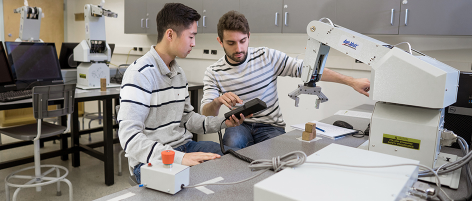 Two UVic students working in an engineering lab