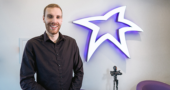 UVic alumni Martin Kellinghusen in a StarFish Medical office room