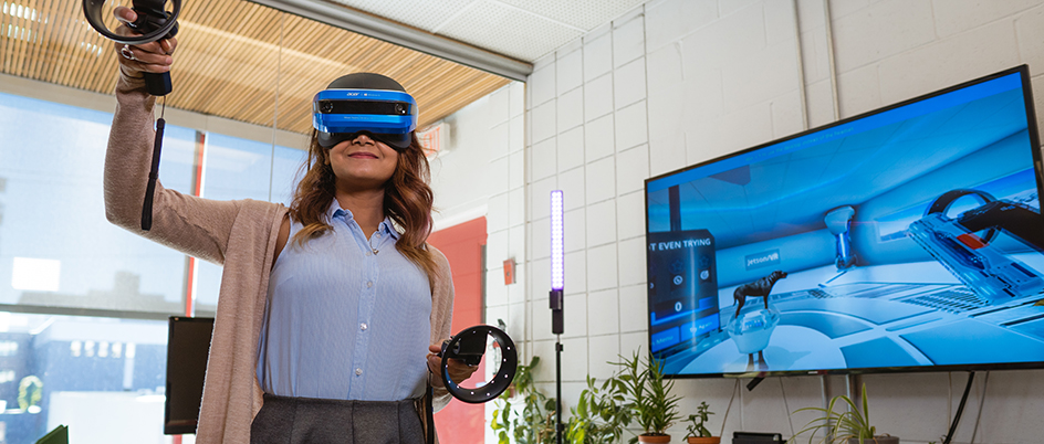 UVic student Tania Akter demonstrating virtual reality during a co-op