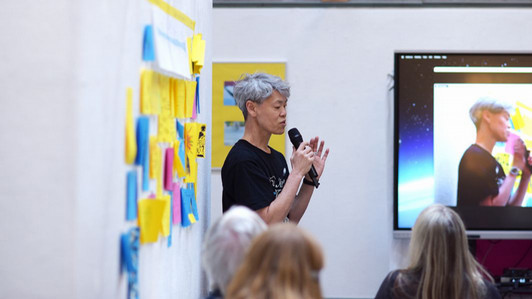Artist in residence kimura byol lemoine is pictured giving an artist talk in the gallery at UVic