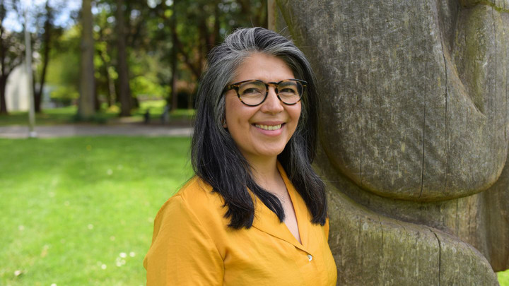 A portrait of Dr. Claudia Diaz-Diaz, pictured outdoors on UVic campus