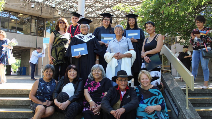 A group of Indigenous Education students pictured outside the Jamie Cassels centre at graduation.