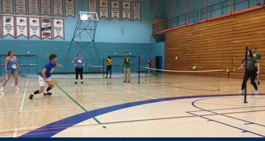 Connor Baerg sprinting for the dropshot in the EPHE 452 Sport Education Pickleball championship