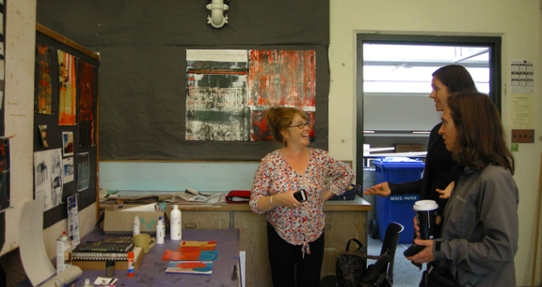 art students talking in an art studio