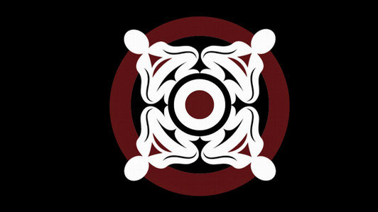 The community wellness logo. The design depicts four human figures who come together to form a perfect circle around the centre point. The middle circle represents First Nations youth and culture, and the four humans represent our families, relationships, and communities. If one of the figures was removed or misplaced, the circle would not be complete and the middle circle would be exposed, but when the four figures are placed correctly, they form a protective border around the centre, which symbolizes the security created when our communities work in a supportive and harmonious fashion. 