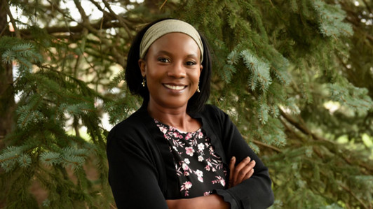 A closeup portrait of Doris Kakuru.