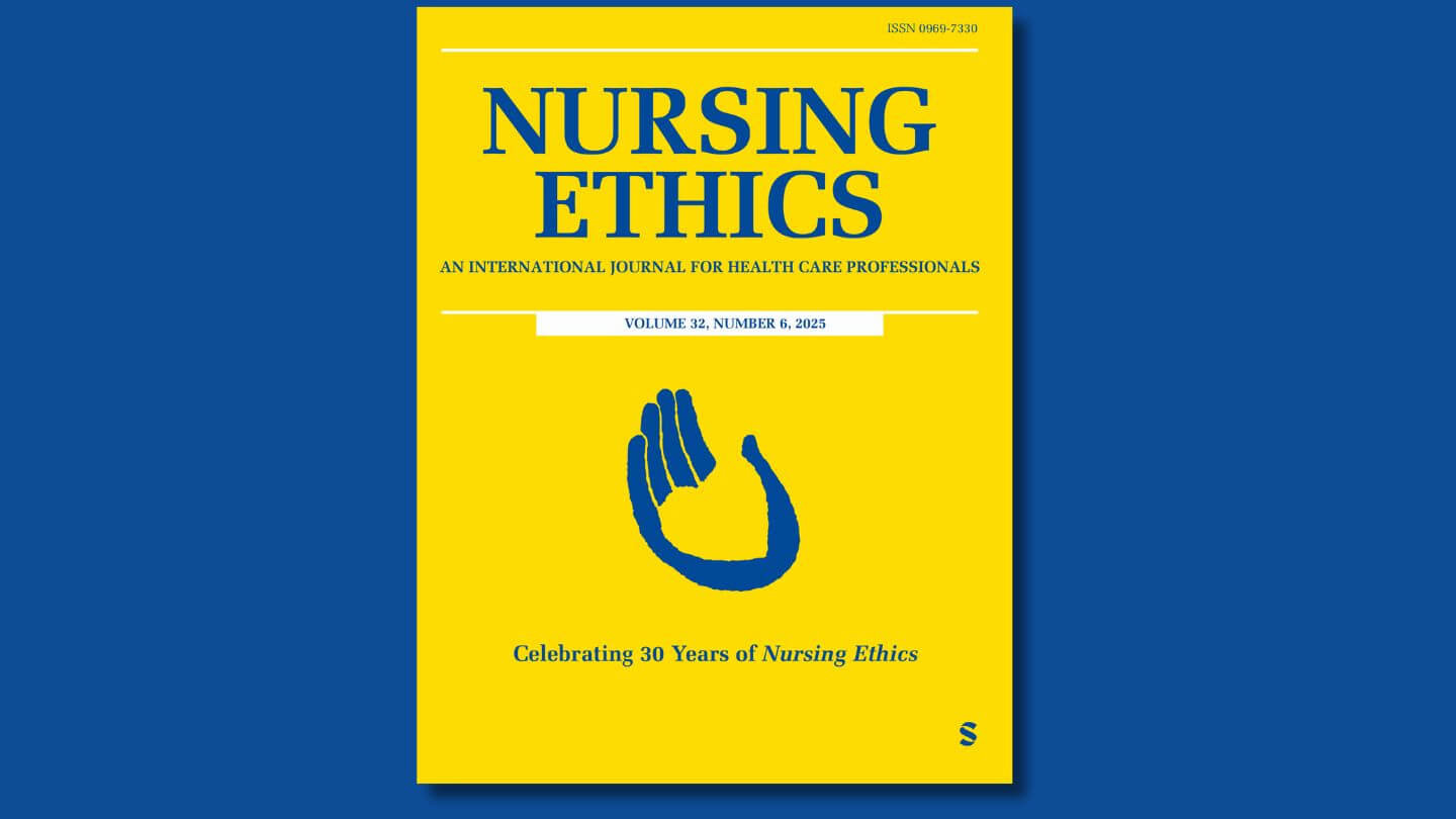 The cover of the Nursing Ethics journal: a bright yellow background with blue text and an image of a blue hand holding a yellow heart.