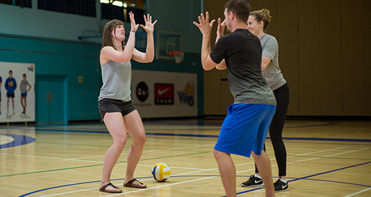 Andrea Dougan coaching in a gym
