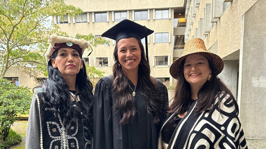 Three CILP graduates on campus for graduation.