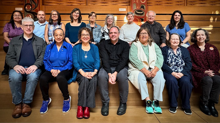 A group photo of the IED Advisory Board sitting in two rows in First Peoples House.