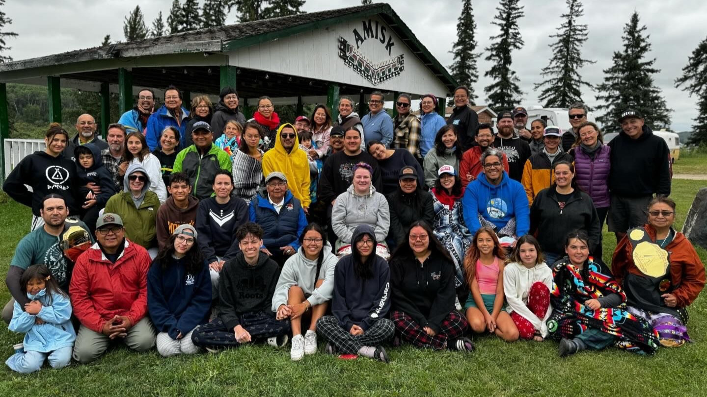 The nle group is pictured outside together.