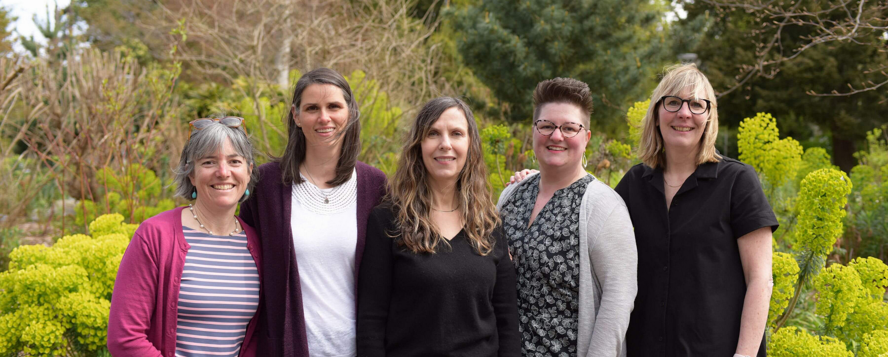 The Teacher Education team is pictured together outside the MacLaurin Building during spring.