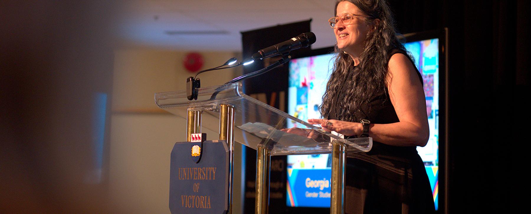 presenter speaking at podium