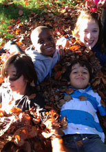 Kids play in leaves