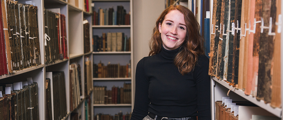 Art history student Josie Greenhill in a library