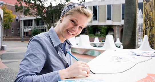 Student painting outside