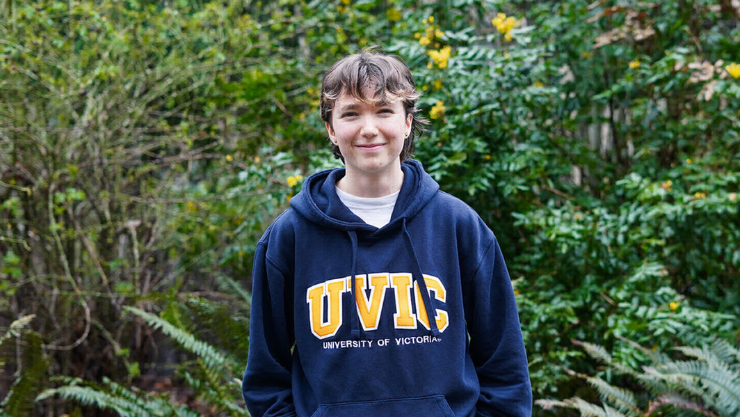 Anya, first-year science student, smiling on campus