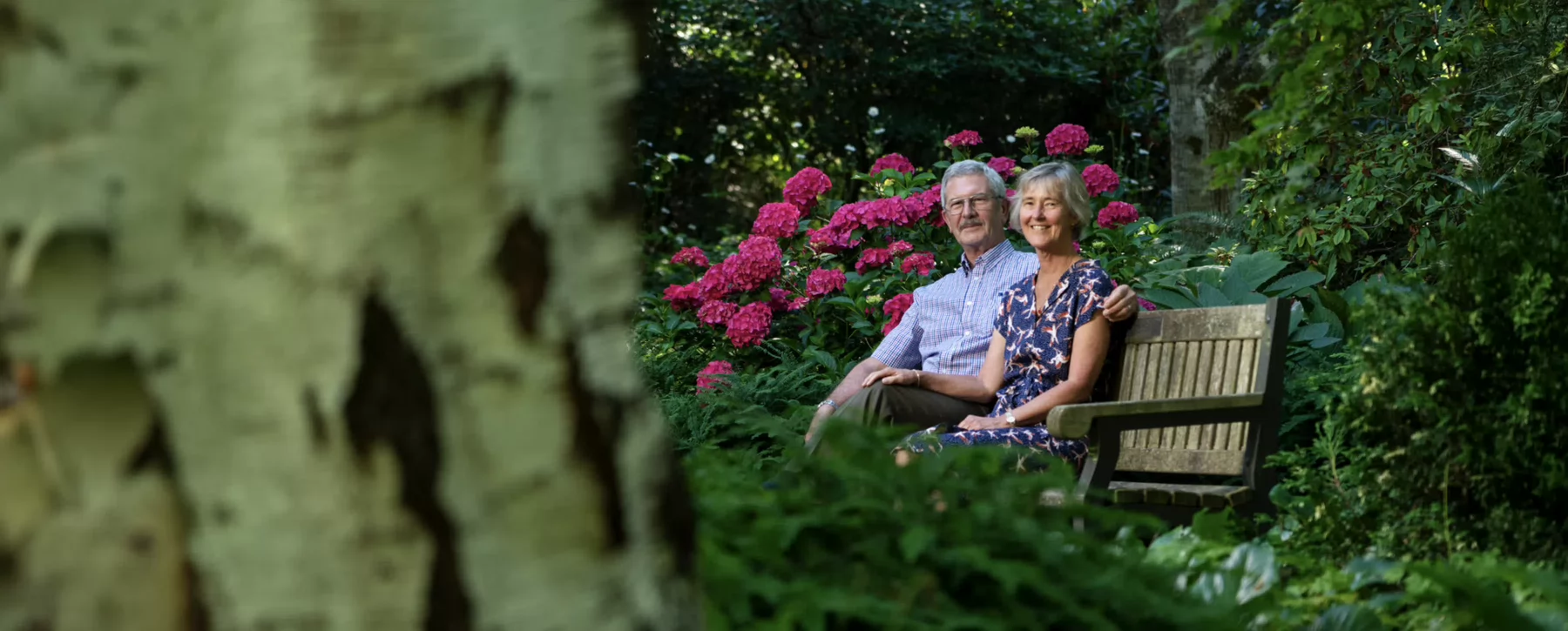 elder couple on bench in park