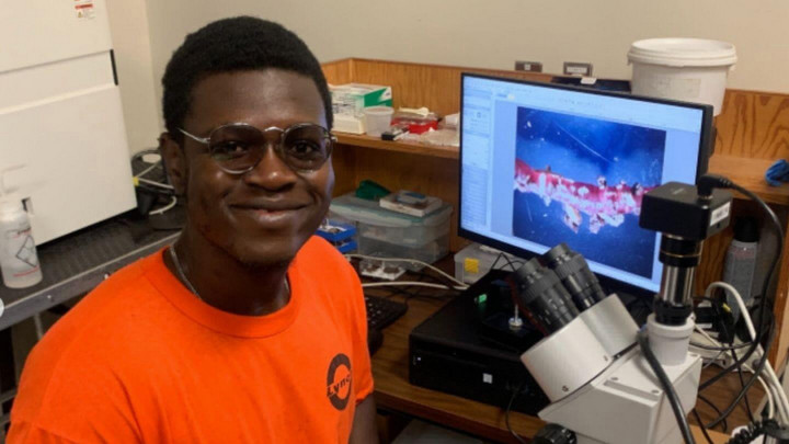 Charles sitting at his desk