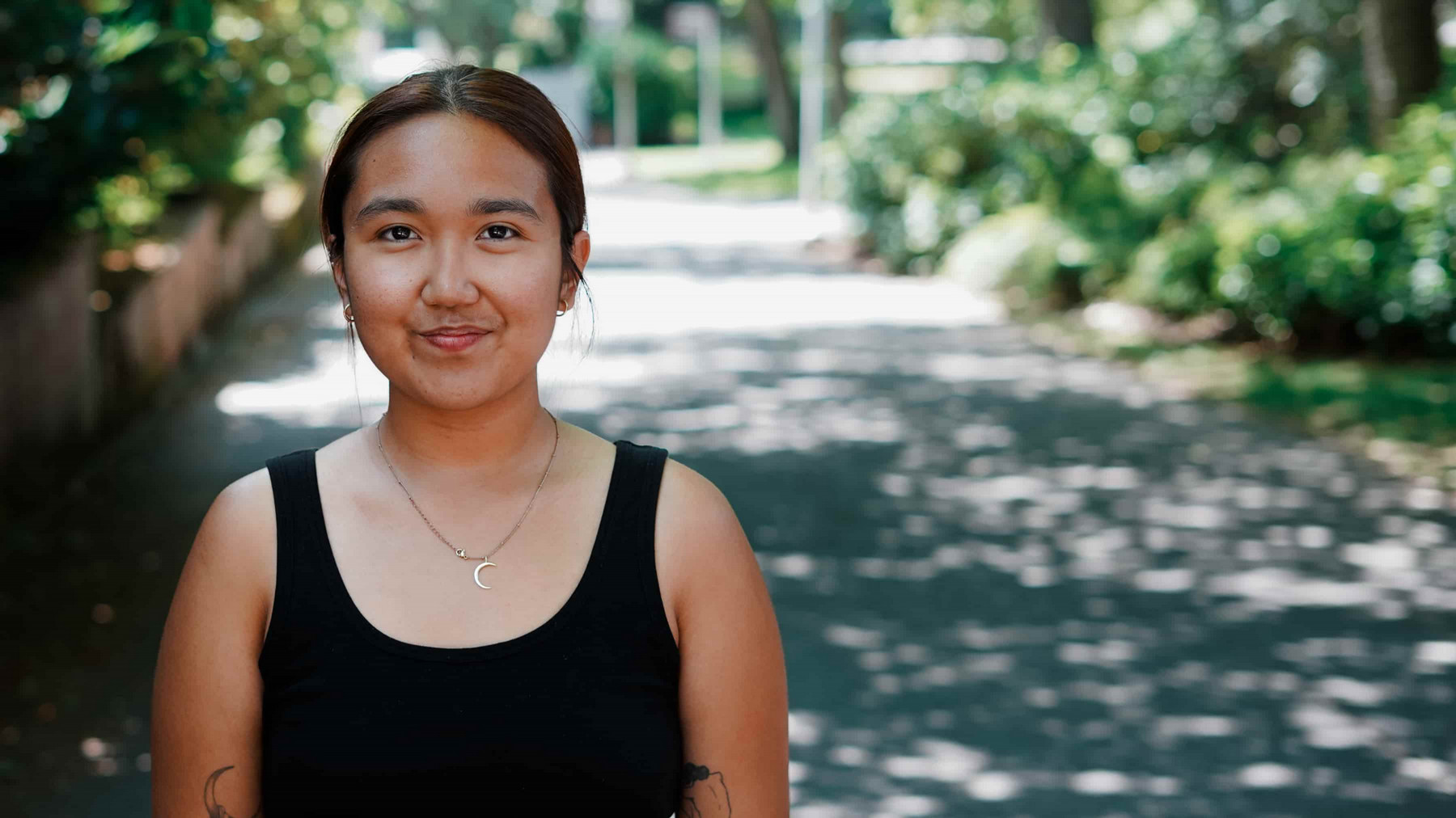 Student portrait on a campus walkway.