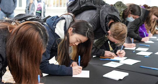 students writing thank you cards